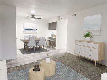 A living room and dining room with a table and chairs